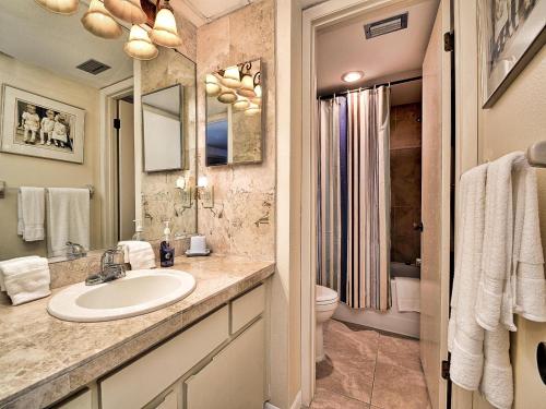 a bathroom with a sink and a toilet at Surfside Condos 204 in Clearwater Beach