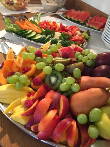 a tray of fruit and vegetables on a table at Hotel Gutshaus Parin - Bio- und Gesundheitshotel in Parin