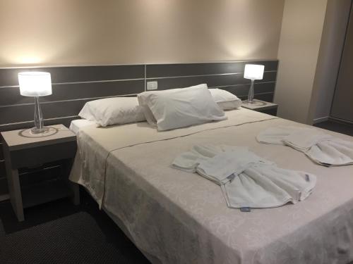 Ένα ή περισσότερα κρεβάτια σε δωμάτιο στο Hotel La Posta