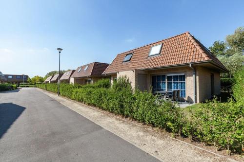 a house on the side of a road at Casa Topsea in De Panne