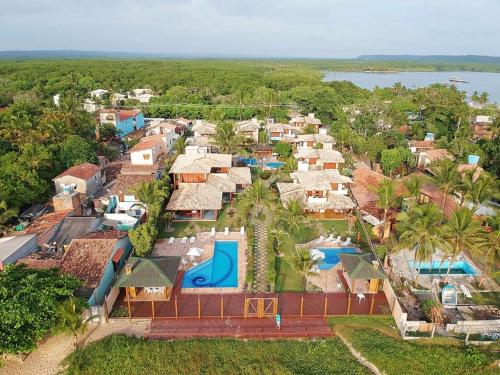 an aerial view of a resort with a water park at Residence Maria Vittoria Praia Arraial in Arraial d'Ajuda