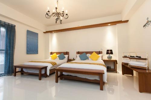 Hualien Professor's Home B&B No. 2198にあるベッド