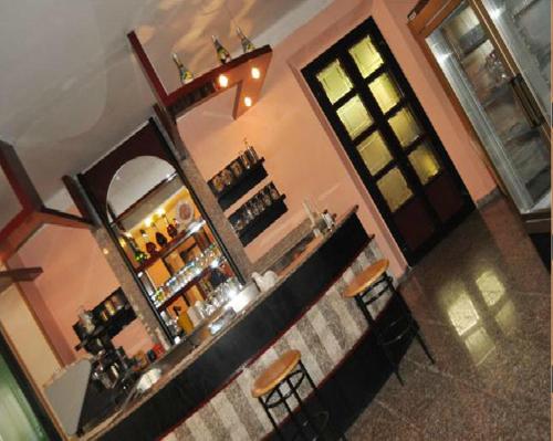 an overhead view of a bar with a mirror at Hotel Villa Cavalli in Rimini