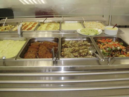 a buffet line with many different types of food at Ruta Del Sol in Ypacarai