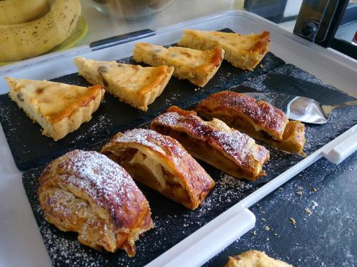 a tray of food with pastries on a table at Magrine Castelfranco Veneto in Castelfranco Veneto