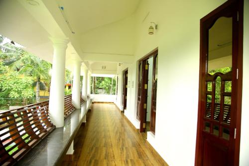 Amritham Holidays Homestay Trivandrumにあるシーティングエリア