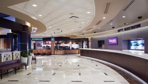 a lobby of a hotel with a bar and a restaurant at Harrah's Gulf Coast, A Caesars Destination in Biloxi