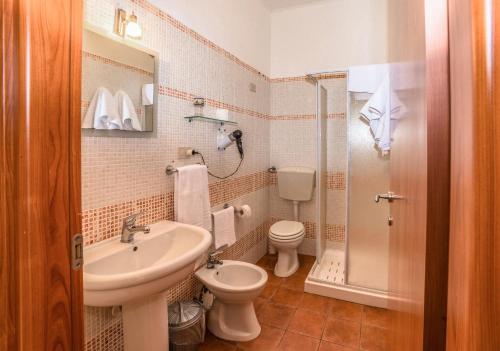 a bathroom with a sink and a toilet at Le Terrazze sul mare in Ustica
