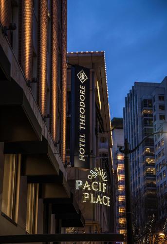 a sign for a parking place on the side of a building at Hotel Theodore in Seattle
