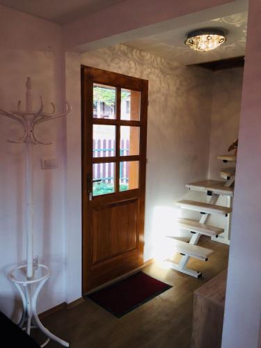 a room with a wooden door and a window at Domik in Mokra Gora