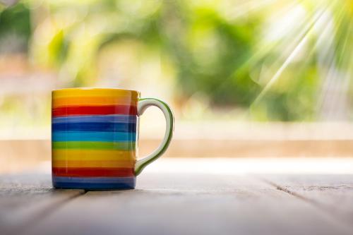 a colorful coffee mug sitting on a table at Castle House Inn in Stockholm