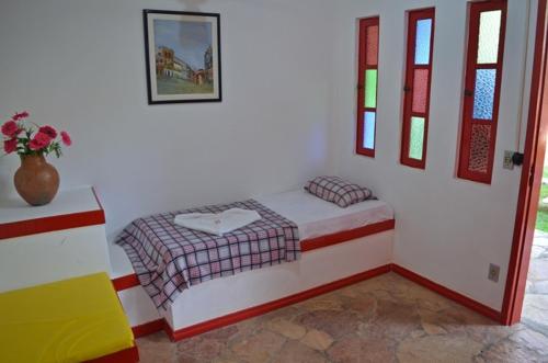 A bed or beds in a room at Pousada Gipsy