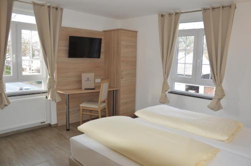 Tempat tidur dalam kamar di Hotel Mezzero