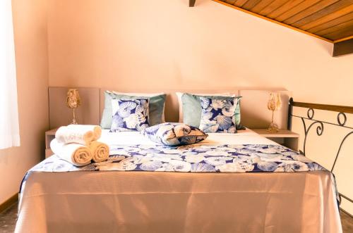 a bed with towels and pillows on it at Residencial Brava Club Exclusive in Búzios