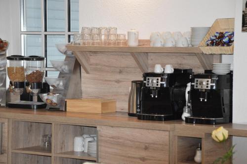 a counter with two coffee machines sitting on it at Hotel Mezzero in Waldshut-Tiengen