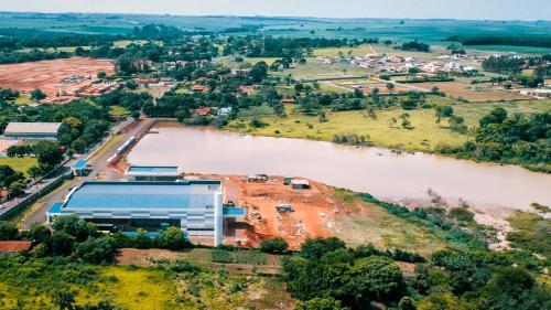 an aerial view of a building under construction next to a river at Hotel Winner in Barretos
