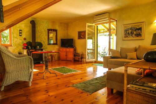 a living room with a couch and a table at Villa Kolacje in Škrip
