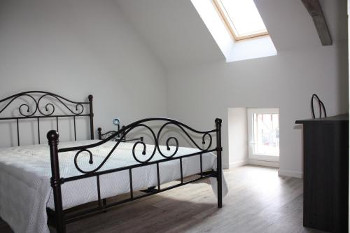 Llit o llits en una habitació de L'Amandier