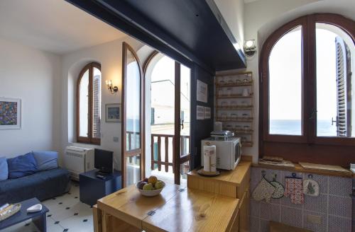 Area soggiorno di Alguerhome Casa Blu sea view