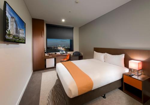 Postel nebo postele na pokoji v ubytování ibis Brisbane Airport