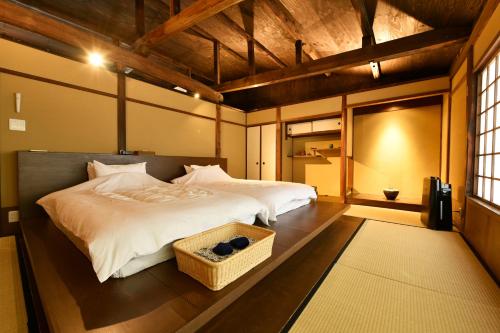 Ένα ή περισσότερα κρεβάτια σε δωμάτιο στο Kuraya Kiyomizu Gojo