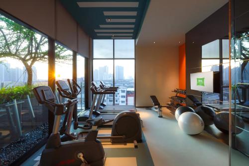 a gym with cardio equipment in a building at ibis Styles Bangkok Sukhumvit Phra Khanong in Bangkok