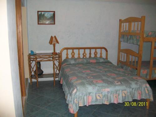 Postel nebo postele na pokoji v ubytování Hostal Cabañas Vistamar