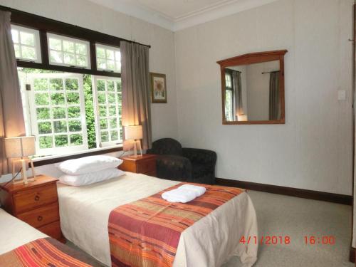 Letto o letti in una camera di Homestead B&B Cambridge