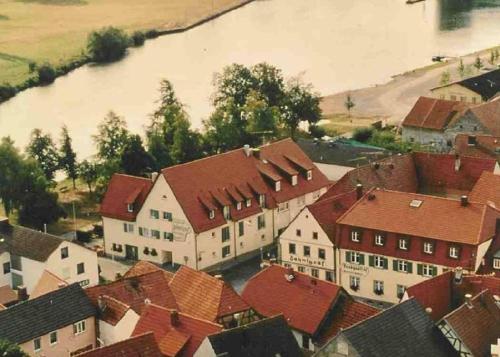 an aerial view of a town with houses and a river at Gästehaus Zehntgraf in Wipfeld
