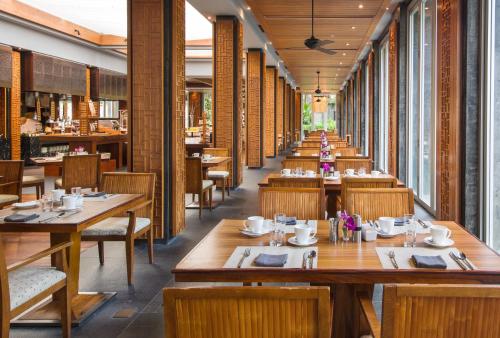 a row of tables and chairs in a restaurant at Mandarin Oriental, Sanya in Sanya