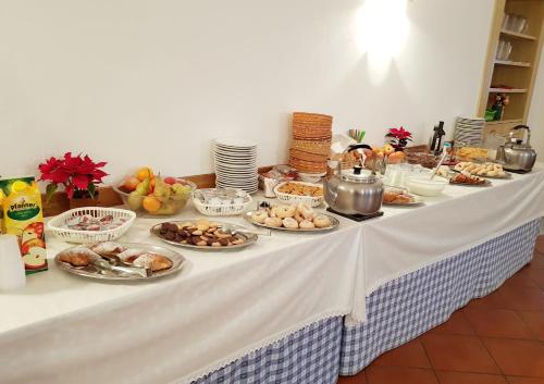 a table with plates of food on it at Casa Baldelli in Dobbiaco