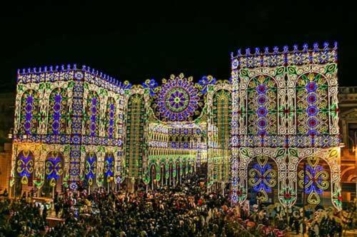 a group of people standing in front of a building with lights at Mediterraneo B&B in Maglie