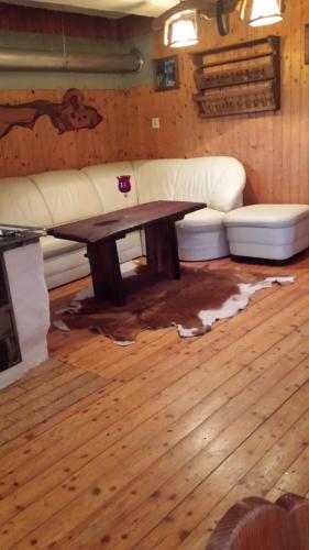 a living room with a couch and a coffee table at Sailer in Malta