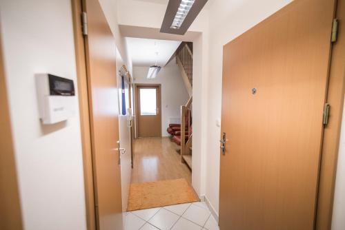 a hallway with a door leading into a room at Horský apartmán Špindlerův Mlýn in Krausovy Boudy