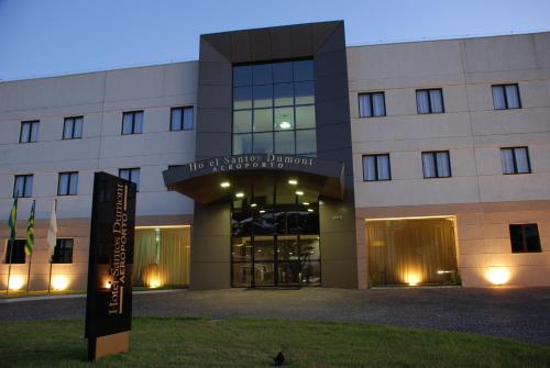 a building with a sign in front of it at Hotel Santos Dumont in Goiânia