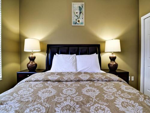 a bedroom with a bed with two lamps at Island Key Condos 302 in Clearwater Beach