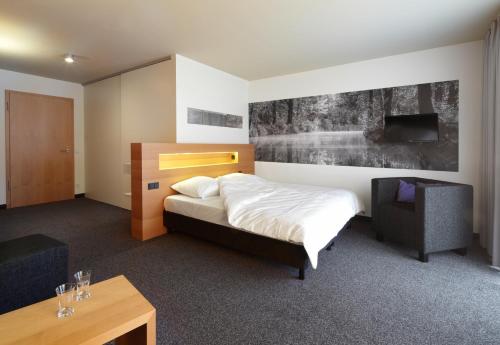 En eller flere senge i et værelse på Spreewald Thermenhotel - Spreewald Therme GmbH