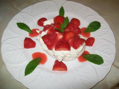 a dessert with strawberries on a white plate at Chapel House in Atherstone