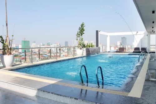 a swimming pool on top of a building at Malis the Residence in Phnom Penh