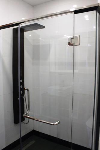 a shower stall with a glass door at Malis the Residence in Phnom Penh