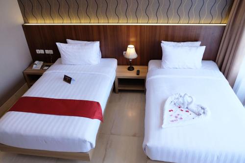 Katil atau katil-katil dalam bilik di Mexolie Hotel