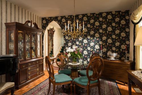 a dining room with a table and chairs at The Winstead Inn in Harwich