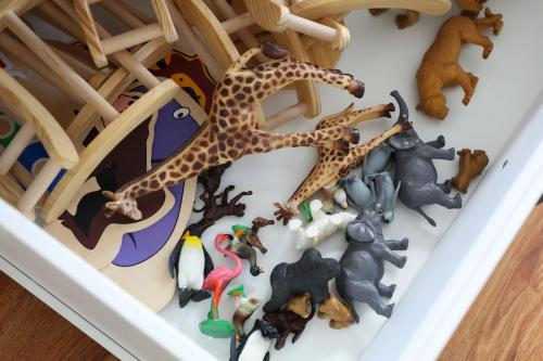 a toy giraffe and a group of toy animals at Ferienhaus Caputh in Caputh