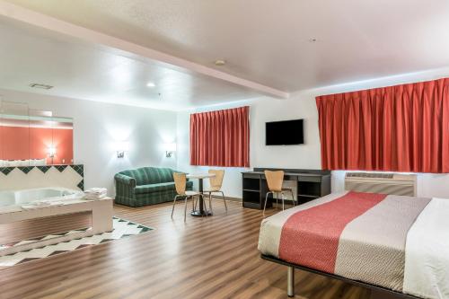 a hotel room with a bed and a desk at Motel 6-Barkeyville, PA in Barkeyville