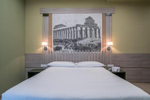 Postel nebo postele na pokoji v ubytování Hotel Palace