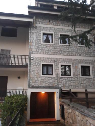 a building with a door in front of it at Appartamento Lucia in Pescocostanzo