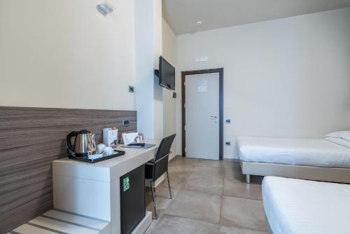 Postel nebo postele na pokoji v ubytování Hotel Palace