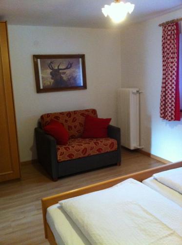 a living room with a couch in a room at Haus Zegg in Nauders