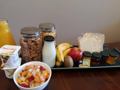 a tray of food with nuts fruit and other food items at Conach House in Cambridge