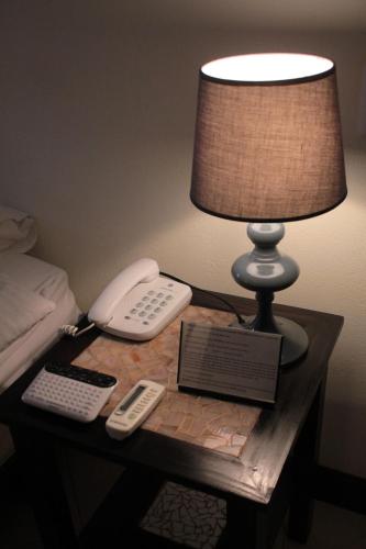 Postel nebo postele na pokoji v ubytování Hotel Luisiana